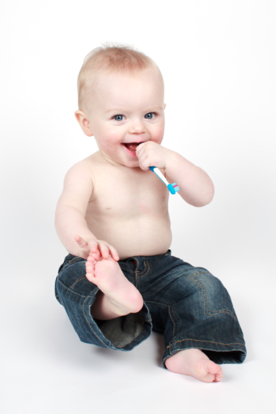 Small boy holding a toothbrush
