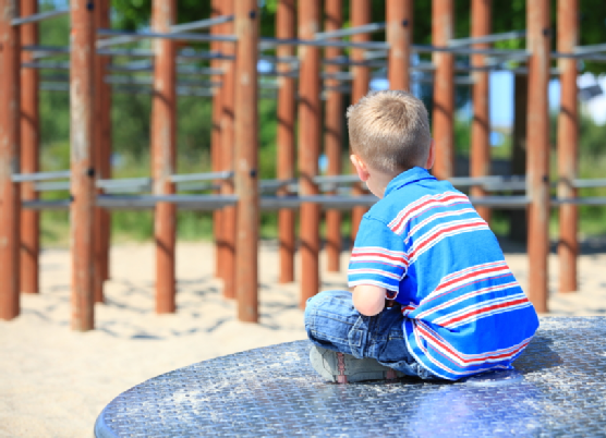 thoughtful child boy or kid on playground