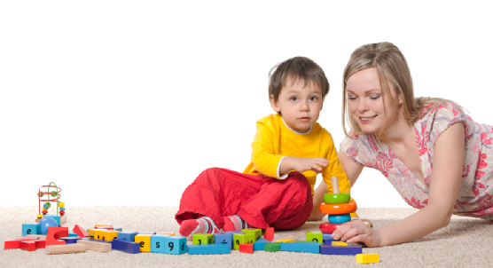 Mother and son on the carpet with toys