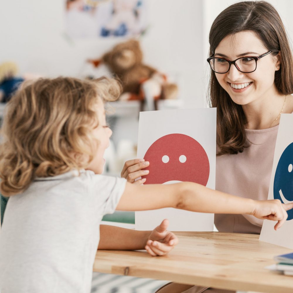 Emotion emoticons used by a psychologist during a therapy session with a child with an autism spectrum disorder.